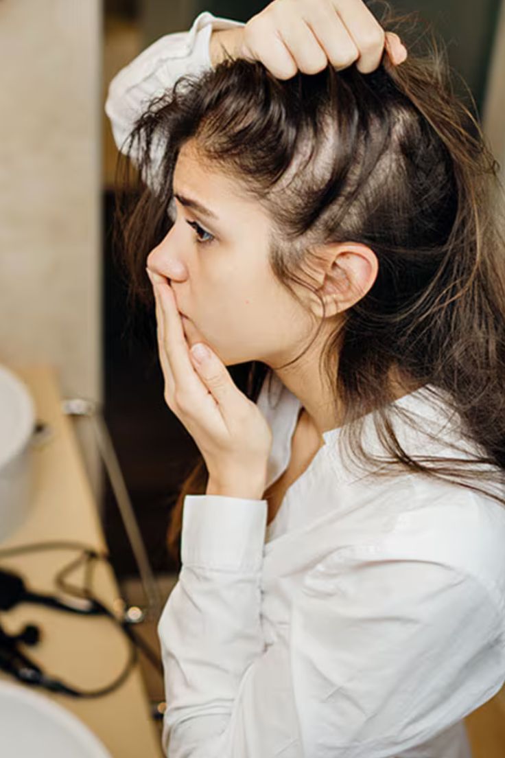 Girl showing concern about her hair